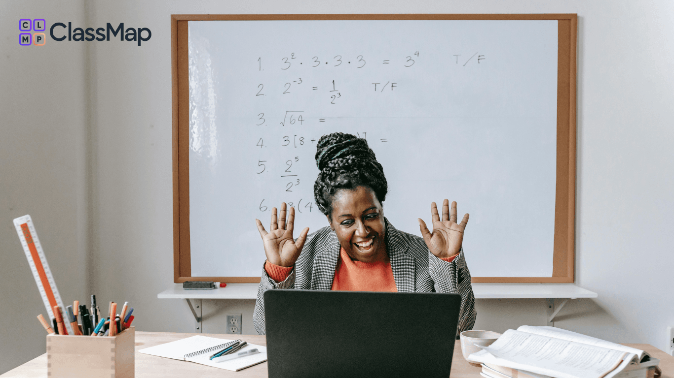 Teacher using a laptop in the classroom