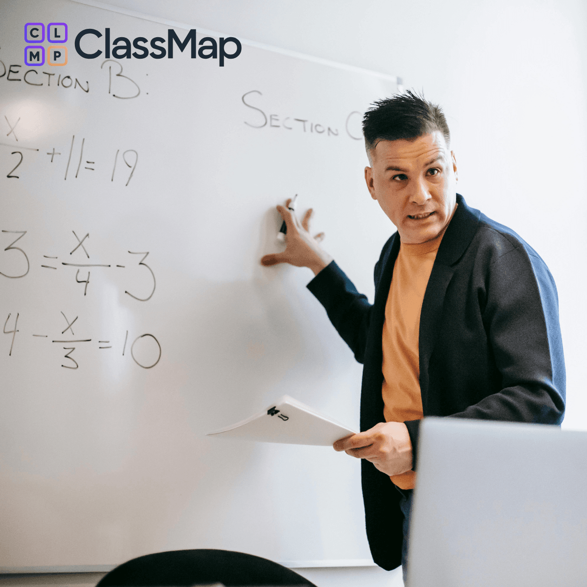 Teacher using a mobile device in class